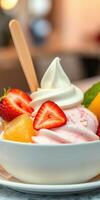 Delightful dessert bowl with soft serve ice cream and fresh fruit garnishes enjoyed in a cozy cafe atmosphere photo