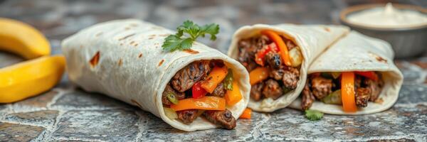 Delicious burritos filled with grilled meat and colorful vegetables on a rustic table photo
