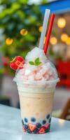 Delicious dessert drink with crushed ice, tapioca pearls, and fresh strawberries in a vibrant cafe setting photo