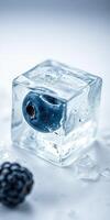 Frozen blueberry encased in ice cube with scattered berries on light background photo