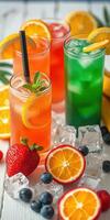 Refreshing colorful summer beverages with fresh fruits and ice on a bright table photo