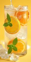 Refreshing citrus drink with ice and mint leaves for a summer quench photo