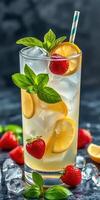 Refreshing summer beverage with lemon, strawberries, and mint served over ice photo