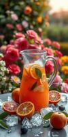 Refreshing citrus beverage served in a glass pitcher surrounded by colorful flowers on a sunny afternoon photo