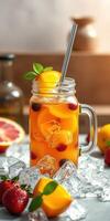 Refreshing fruit beverage served in a mason jar with ice and mint on a wooden table with fresh fruits photo