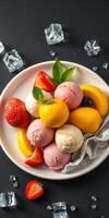 Colorful ice cream dessert served with fresh fruit and decorative ice on a dark background photo