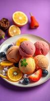Colorful ice cream scoops served with fresh fruit on a vibrant purple background photo