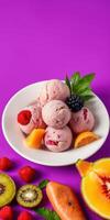 Delicious berry ice cream served in a bowl with vibrant fruits on a bright purple background photo