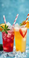 Refreshing summer cocktails with colorful fruits and ice garnished with mint and striped straws in a bright setting photo