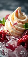 Delicious raspberry cream dessert garnished with fresh berries and mint leaves on crushed ice photo
