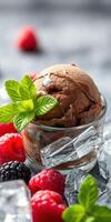 Chocolate ice cream served in a glass dish surrounded by fresh berries and ice cubes on a gray background photo