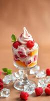 Delightful dessert featuring whipped cream and fresh raspberries served in a glass cup with icy accents photo