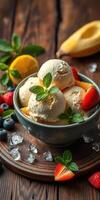 Delicious bowl of creamy ice cream garnished with fresh fruits and mint leaves nestled on a rustic wooden table photo