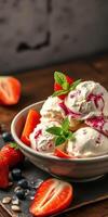 Delightful ice cream dessert with fresh strawberries and blueberries served in a bowl photo