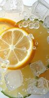 Refreshing lemonade with ice cubes and bubbles creating a summer drink experience photo