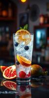 Refreshing cocktail with fresh fruits on a bar counter during evening hours photo