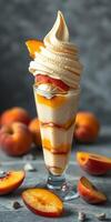 Creamy peach dessert with whipped topping and fresh fruit on a gray background photo