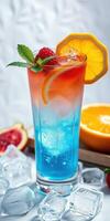 Refreshing colorful cocktail with fruits served in a tall glass on ice at a summer gathering photo