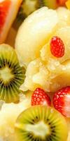 Refreshing frozen dessert with vibrant fruits including kiwi and strawberries served in a tropical setting photo