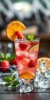 Refreshing summer cocktail with fresh fruit garnishes served in a clear glass photo
