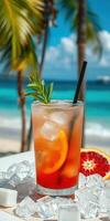 Refreshing tropical drink with citrus garnishes on a beachside table under a clear blue sky photo