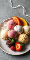 Colorful scoop of ice cream with fresh fruits served on a plate in a modern setting photo