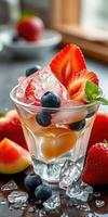 Refreshing summer cocktail with fresh fruits served on a wooden table during daytime photo