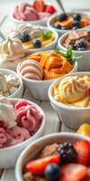 Variety of colorful ice cream and sorbet served in small bowls at a dessert shop during a warm afternoon photo