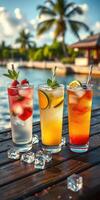 Refreshing tropical cocktails on a wooden table by the water during sunset near a palm tree resort photo
