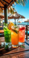 Refreshing tropical cocktails on a wooden table by the beach during a sunny day photo