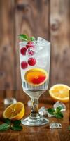 Refreshing cocktail with raspberries and citrus served in a tall glass on wooden surface photo