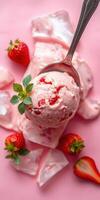 Delicious strawberry ice cream scoop with fresh strawberries on a pink background photo