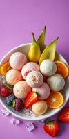 Colorful dessert bowl filled with various ice cream flavors and fresh fruit on a vibrant purple background photo