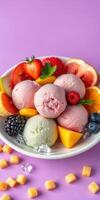 Colorful ice cream dessert with fresh fruits and sweets served on a vibrant pink background photo