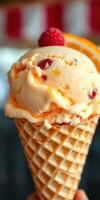 Ice cream cone topped with raspberries and orange slice in a colorful setting during summer photo
