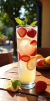 Refreshing beverage with strawberries and lemon served outdoors on a sunny day photo