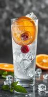 Refreshing citrus drink with ice, fresh fruit, and mint garnishing on a stylish background photo