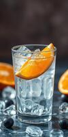 Refreshing cocktail with ice, orange slice, and blueberries on a dark surface in a cozy setting photo