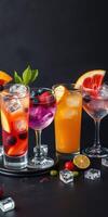Refreshing cocktail display featuring vibrant drinks with fruits and ice on a dark background photo