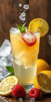 Refreshing fruit beverage with lemon and berries served on a wooden table photo