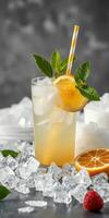 Refreshing citrus drink served over ice with orange and mint garnish in a stylish glass photo