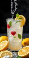 Refreshing drink with lemon, mint, and berries in a tall glass surrounded by fresh lemons photo