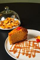 a plate of food with a piece of cake on it and a piece of cake on it. photo
