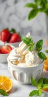 Refreshing dessert with ice cream topped with mint leaves and fruits in a bright setting photo