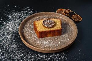 a piece of cake with a slice of lemon on it photo