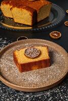 a piece of cake with a slice of lemon on it photo