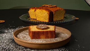 a piece of cake with a slice of lemon on it photo