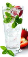Refreshing mint and strawberry beverage garnished with cooling ice cubes and fresh mint leaves photo
