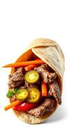 Delicious beef wrap filled with fresh vegetables and jalapenos served on a white background photo