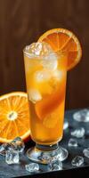 Refreshing citrus cocktail garnished with orange slices and ice cubes on a wooden background photo